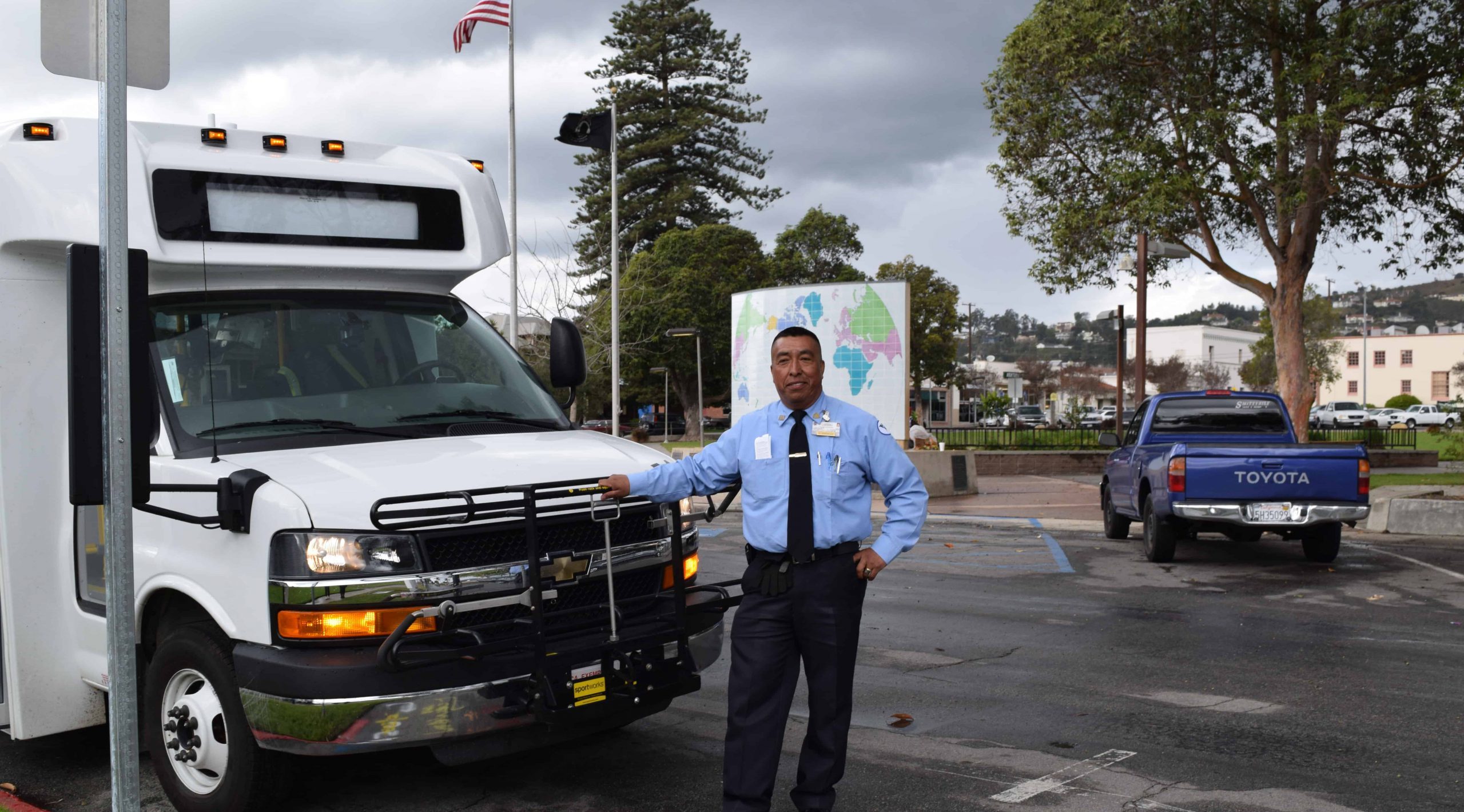 Driver in front of Valley Express bus